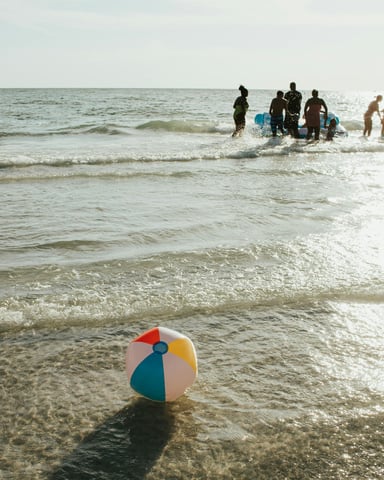 Kids playing on the beach at a summer event