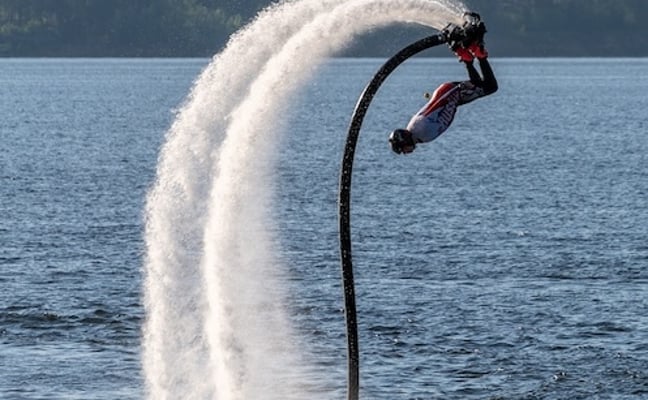 Man on a flyboard soaring above the water